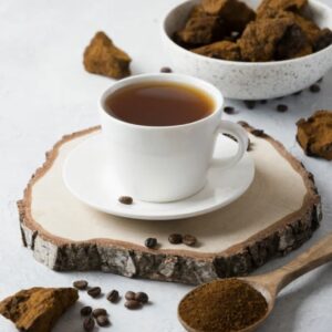 Loose-leaf Decaf Chaga Mushroom Coffee blend with Michigan chaga, chicory, and dandelion root in a rustic ceramic mug.